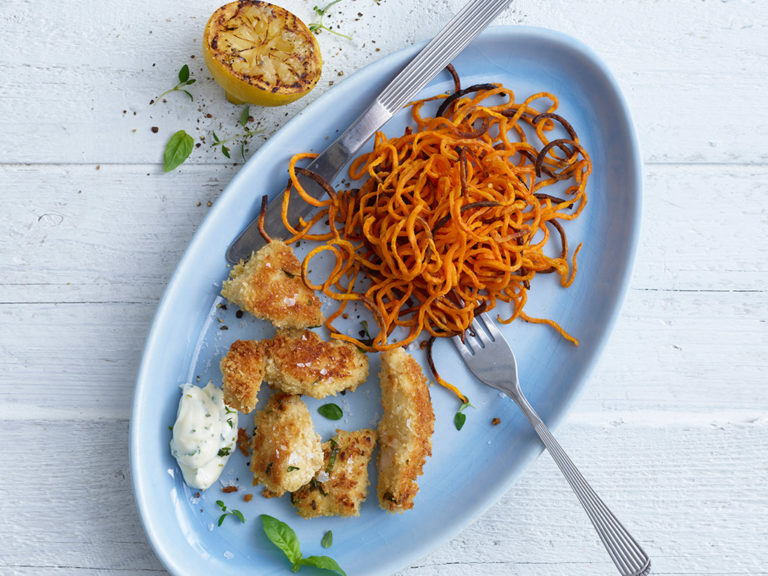 Herby Chicken Nuggets with Spiralized Sweet Potato Curls recipe by Annabel Karmel