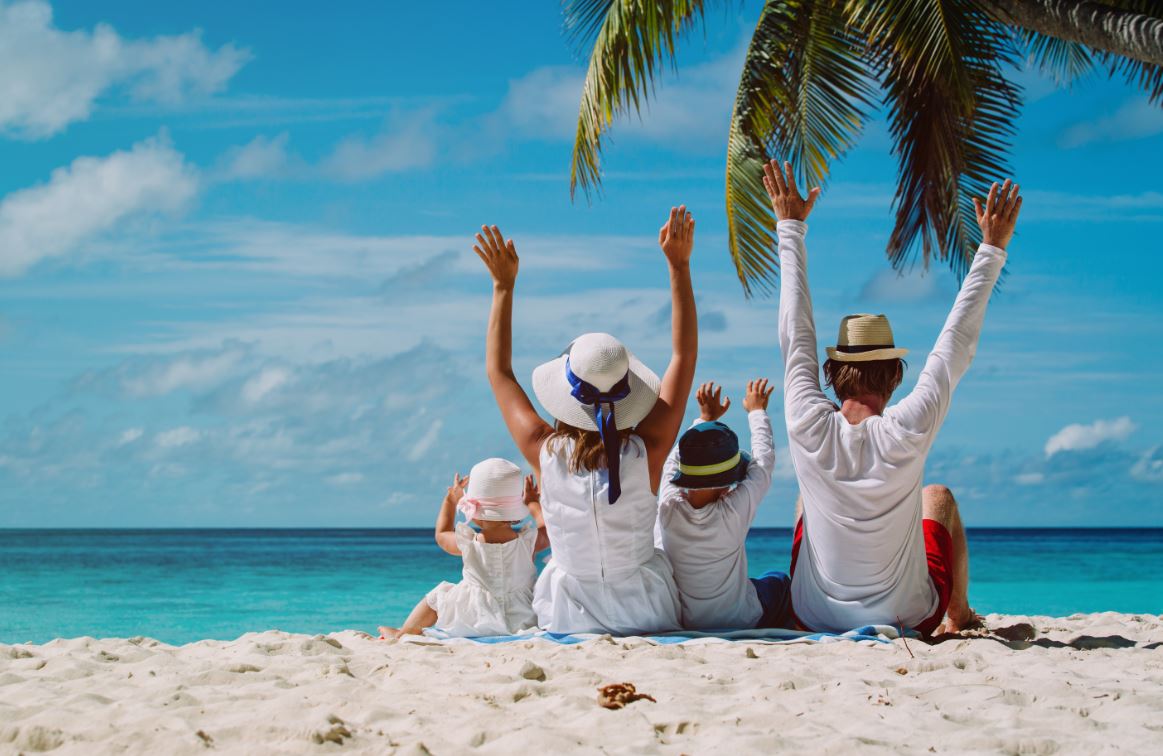 Family at the beach by Annabel Karmel